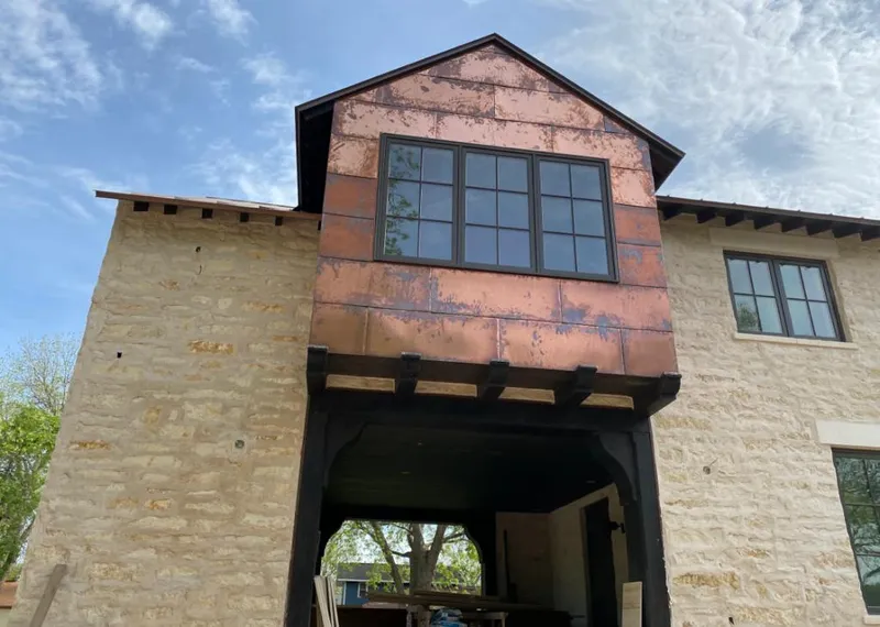 Copper metal panel facade on a stone building for Skylight Installation in Hermosa Beach
