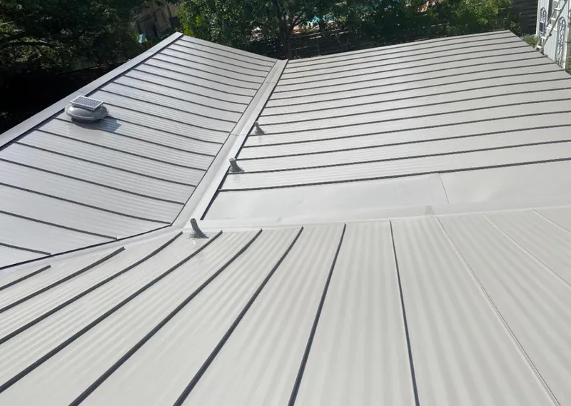 Solar attic fan installed on a metal roof for Roof Ventilation in Hermosa Beach